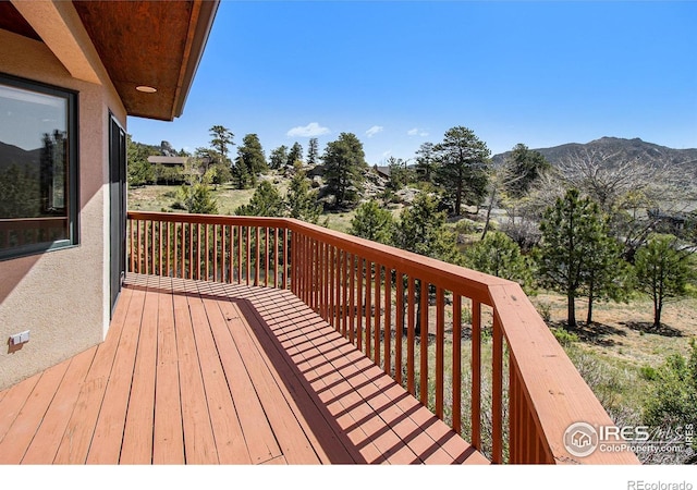 wooden terrace with a mountain view