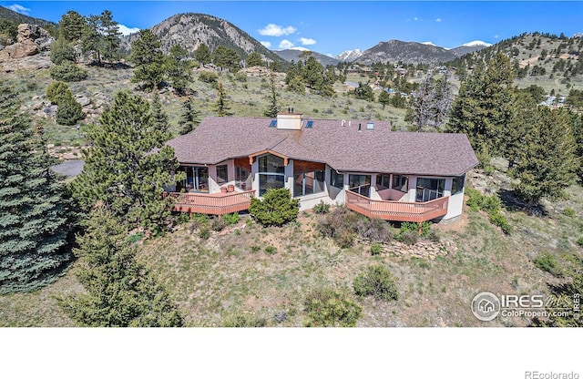 view of front of house with a deck with mountain view