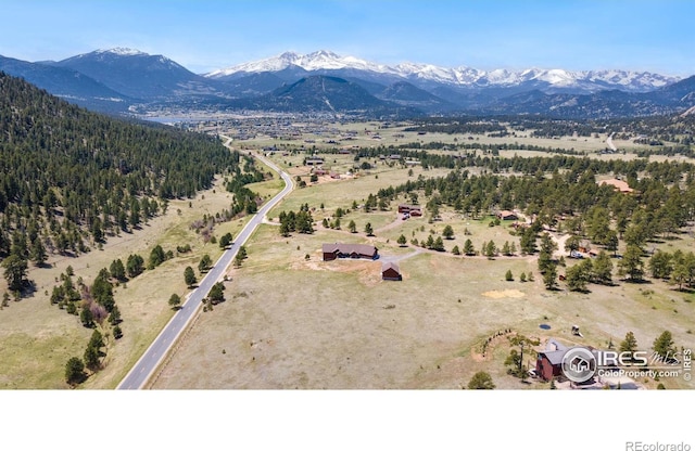 drone / aerial view featuring a mountain view