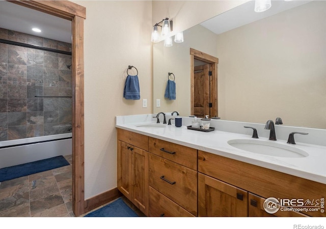 bathroom with walk in shower and vanity