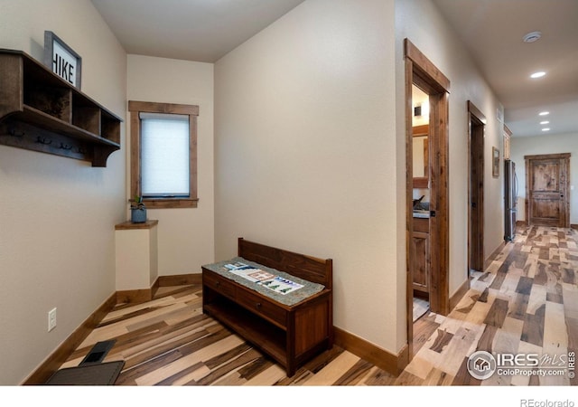 corridor featuring light hardwood / wood-style flooring