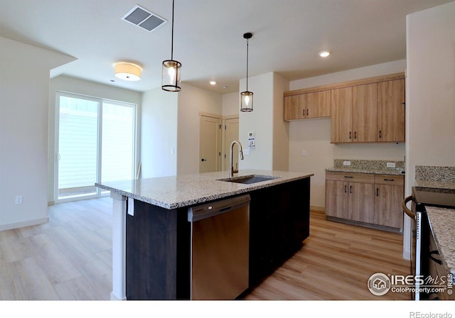 kitchen with light stone countertops, dishwasher, sink, hanging light fixtures, and a center island with sink