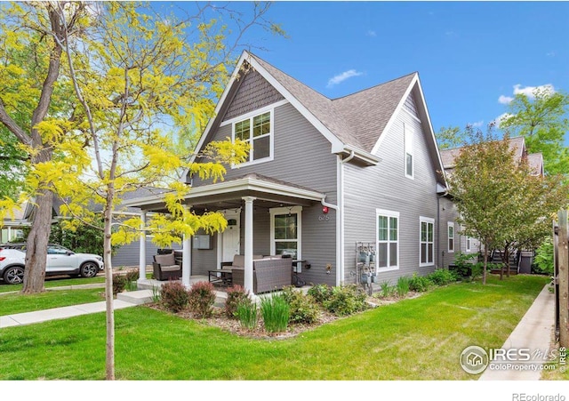 view of front facade featuring an outdoor living space, a porch, and a front yard