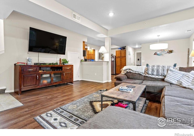 living room with dark wood-type flooring