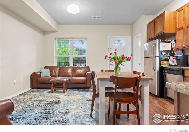 dining space featuring light hardwood / wood-style floors