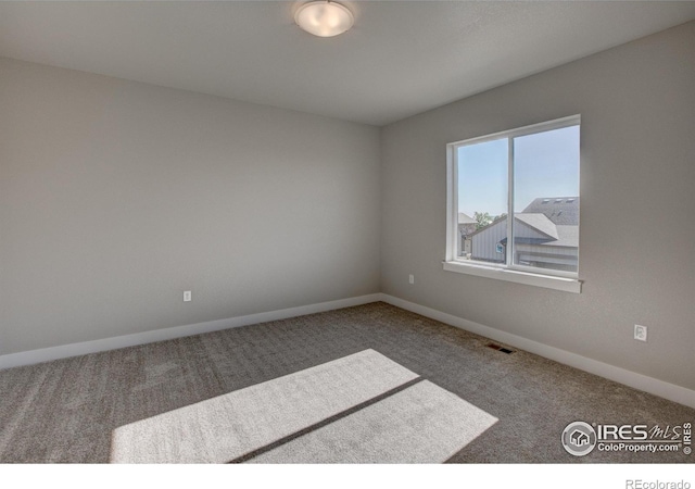 unfurnished room with carpet floors