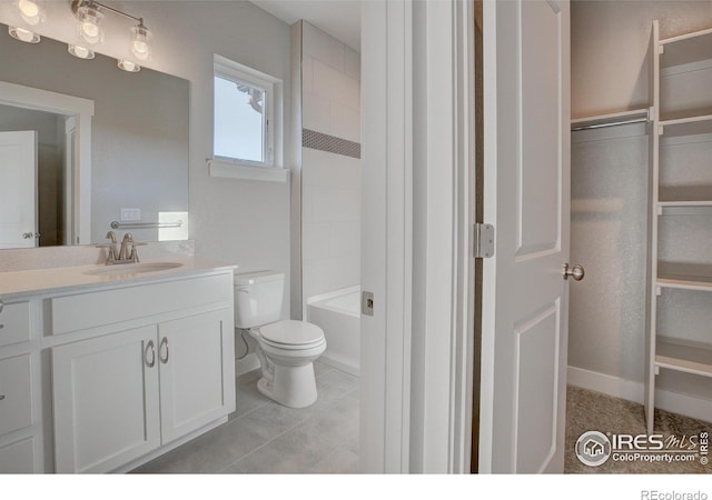 full bathroom featuring tiled shower / bath combo, oversized vanity, toilet, and tile floors