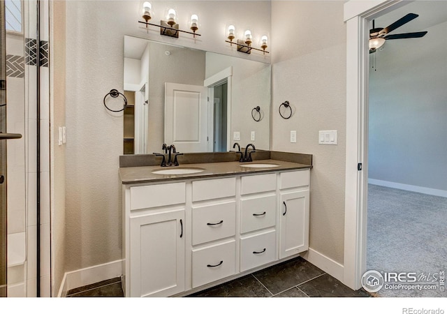 bathroom with ceiling fan and vanity