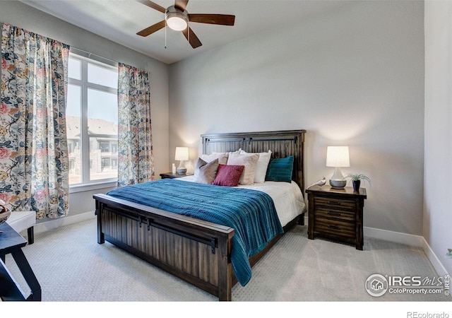 bedroom featuring ceiling fan and light colored carpet