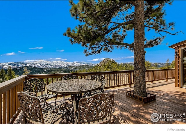 wooden deck with a mountain view