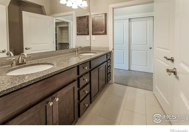 bathroom featuring tile patterned flooring and vanity