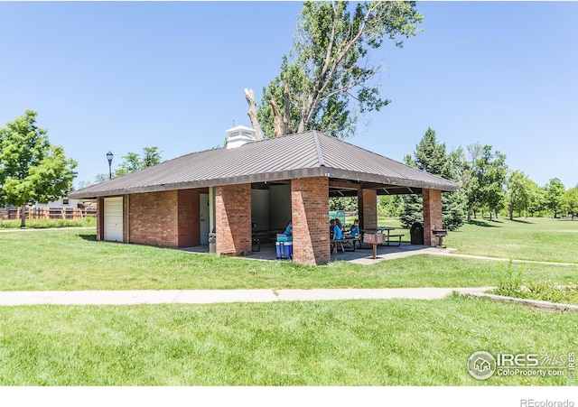 view of home's community with a gazebo, a yard, and a patio