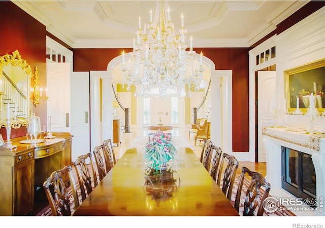 dining area with a notable chandelier and ornamental molding