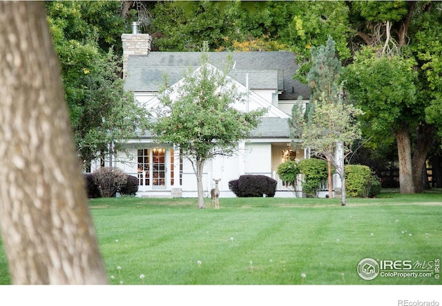 exterior space featuring a front lawn