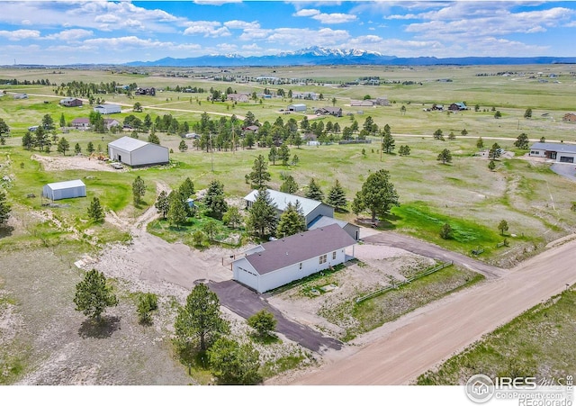 bird's eye view featuring a mountain view and a rural view