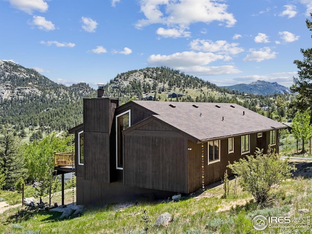 exterior space featuring a deck with mountain view