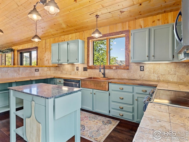 kitchen with hanging light fixtures, dark hardwood / wood-style flooring, appliances with stainless steel finishes, wooden ceiling, and sink