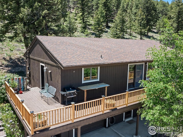 rear view of property with a deck