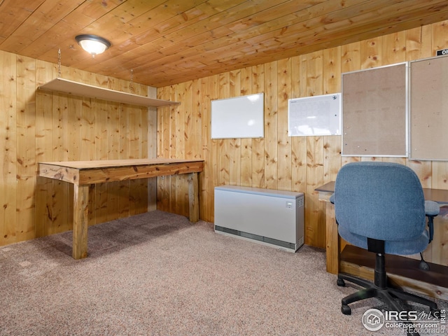 carpeted office space with wooden ceiling and wood walls