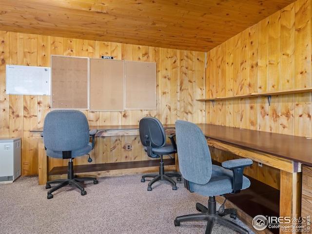 office space with wooden walls, wood ceiling, and carpet