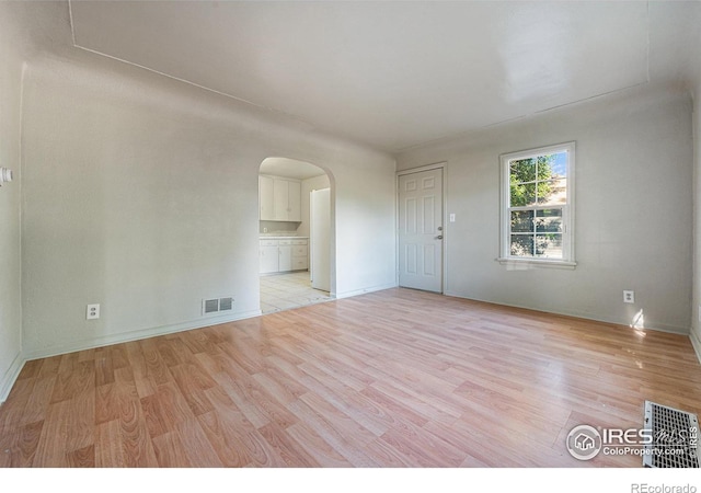 unfurnished room with light hardwood / wood-style flooring