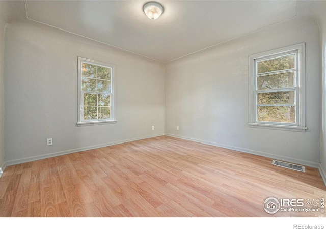 empty room featuring light hardwood / wood-style floors