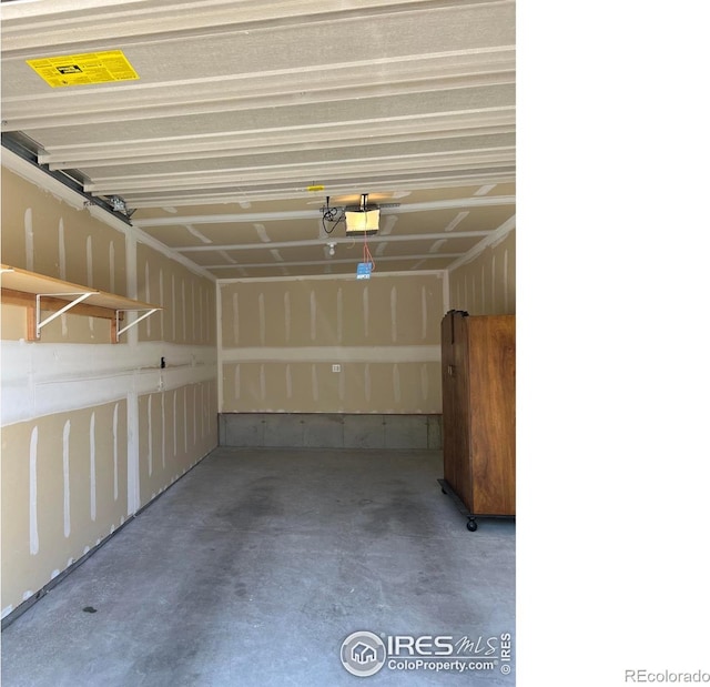 garage featuring a garage door opener