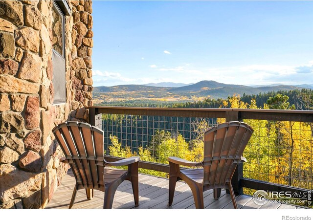 balcony with a deck with mountain view