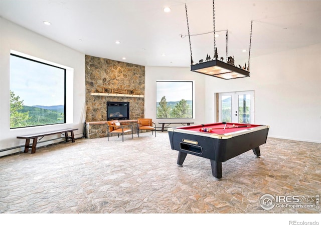 recreation room featuring french doors, a baseboard heating unit, and pool table