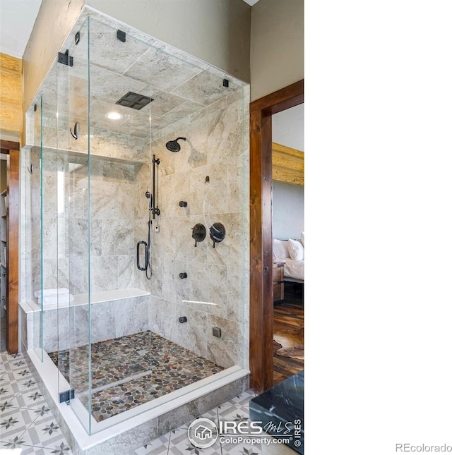 bathroom featuring an enclosed shower