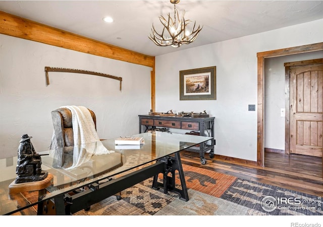 office space featuring dark hardwood / wood-style flooring and an inviting chandelier