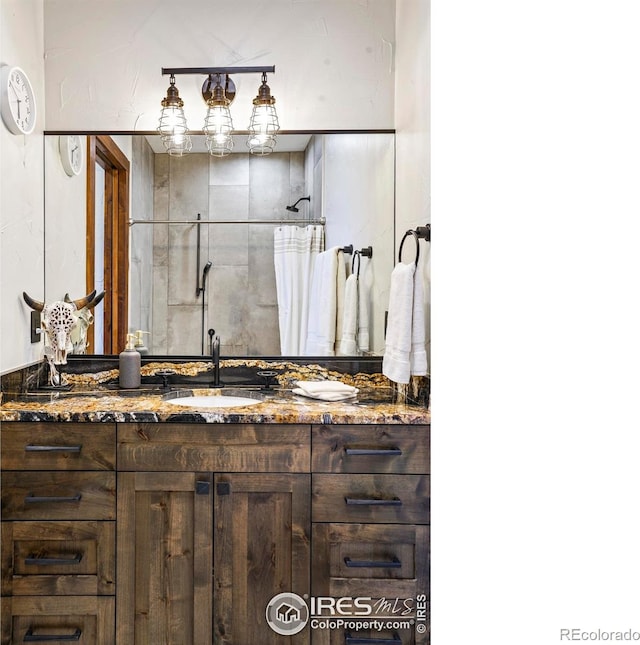 bathroom with vanity and walk in shower