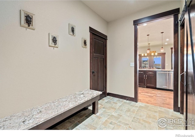 interior space featuring a chandelier and light hardwood / wood-style floors