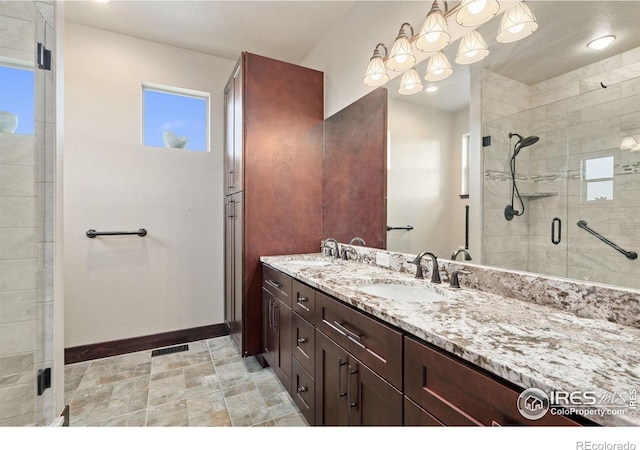 bathroom with vanity and an enclosed shower