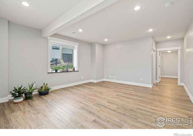 spare room with light hardwood / wood-style floors