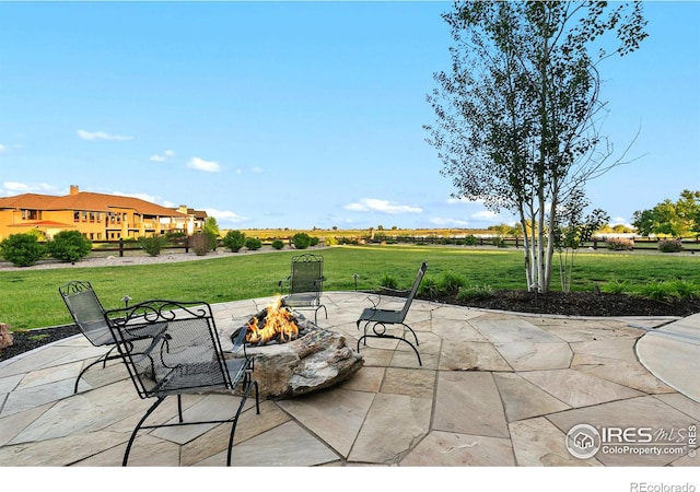 view of patio featuring a fire pit