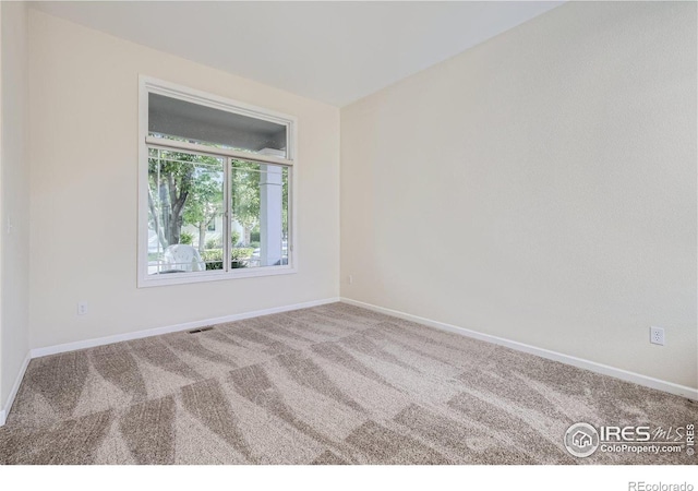 view of carpeted spare room