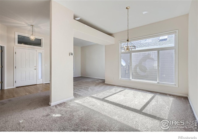 unfurnished dining area featuring carpet floors