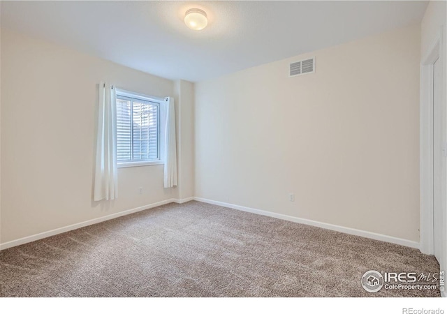 unfurnished room featuring carpet flooring