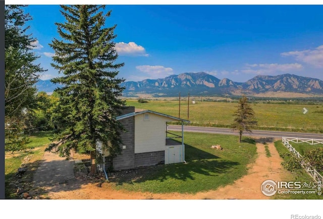 view of mountain feature with a rural view