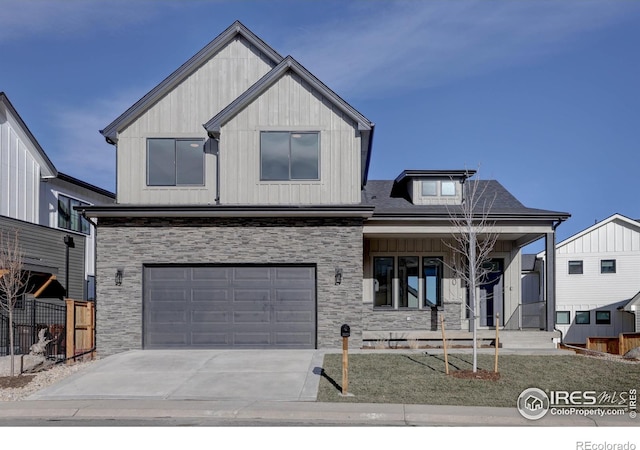 view of front of home featuring covered porch and a garage