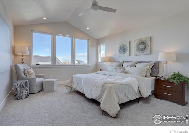 carpeted bedroom with ceiling fan and vaulted ceiling