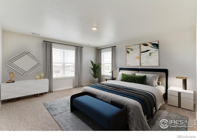 bedroom featuring carpet and a textured ceiling