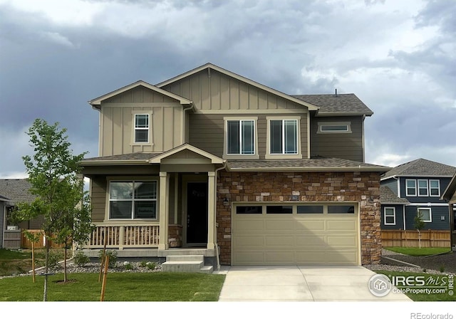 craftsman inspired home with a porch and a garage