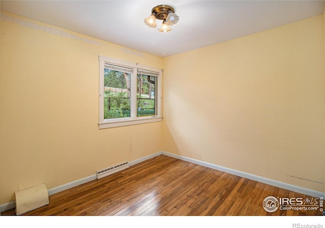 spare room featuring hardwood / wood-style flooring