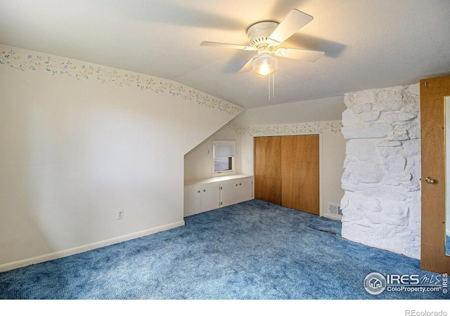 additional living space featuring carpet, ceiling fan, and lofted ceiling