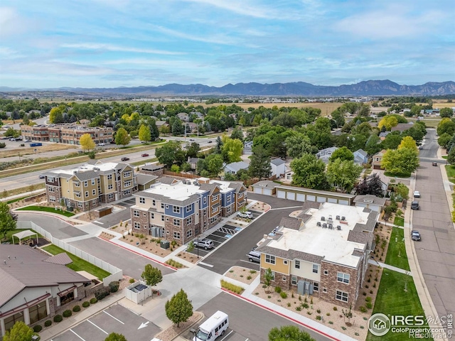 birds eye view of property featuring a mountain view