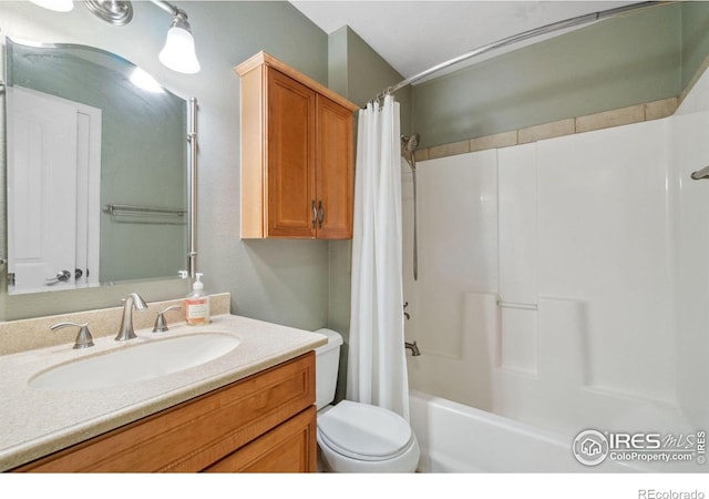 bathroom with shower / bath combo, vanity, and toilet