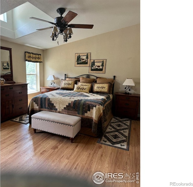 bedroom featuring hardwood / wood-style flooring and ceiling fan