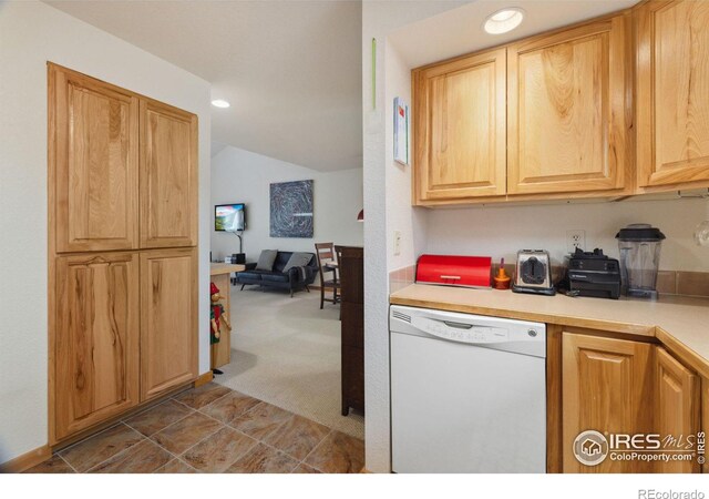 kitchen with recessed lighting, light countertops, carpet flooring, vaulted ceiling, and dishwasher